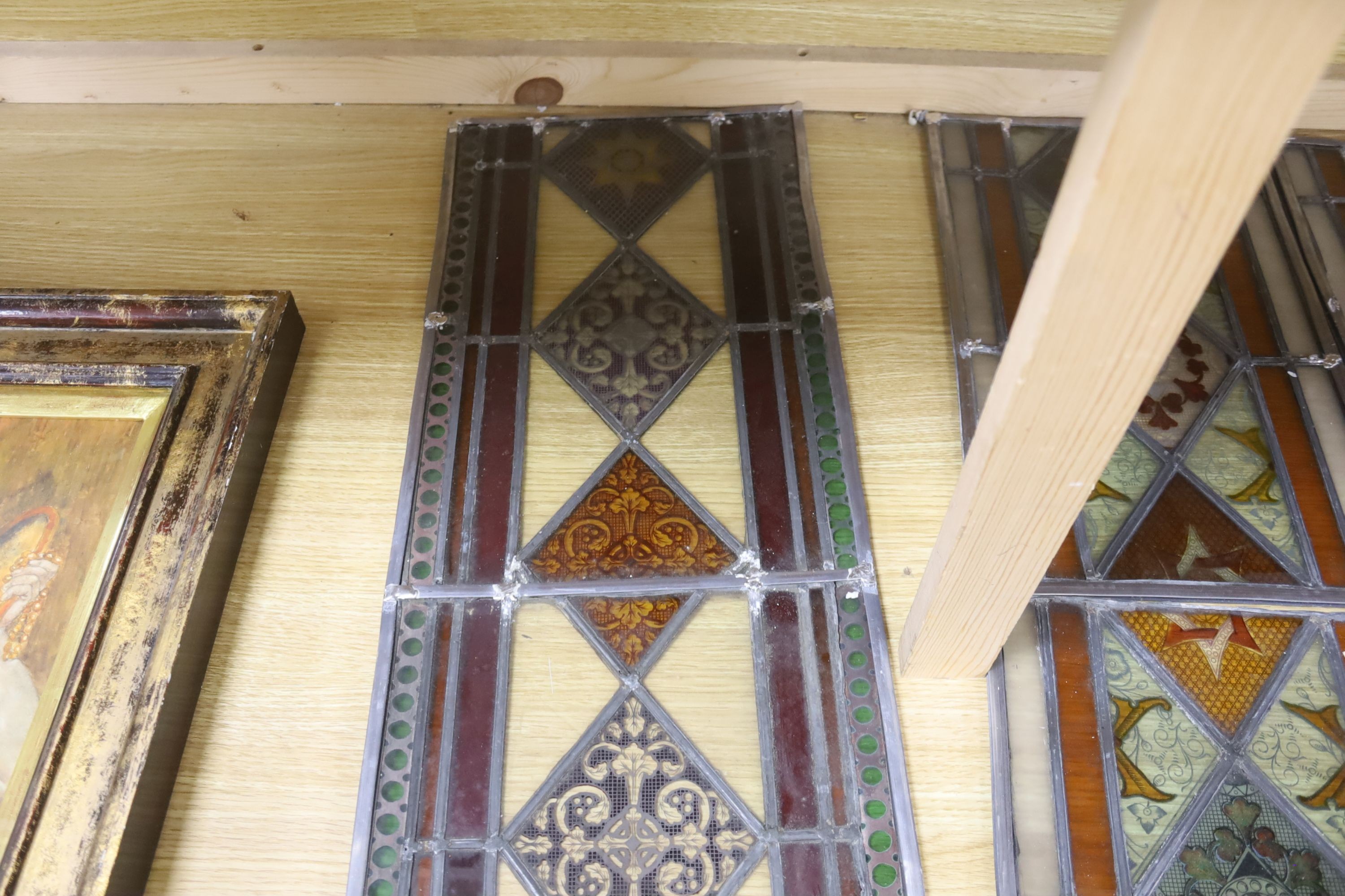 Four late 19th century stained and lead glass panels, 81 x 27cm